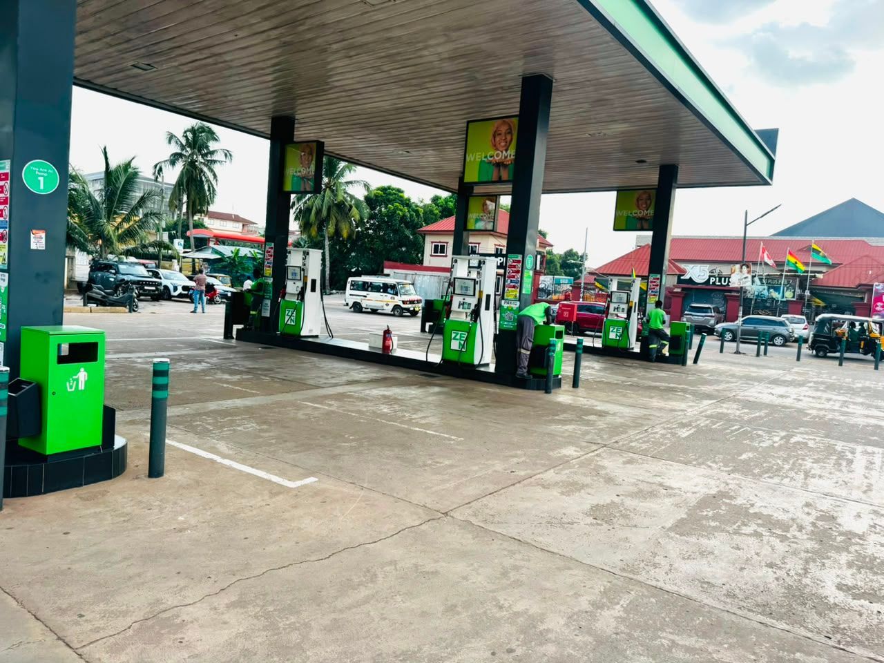 Petrol station with a green and white canopy